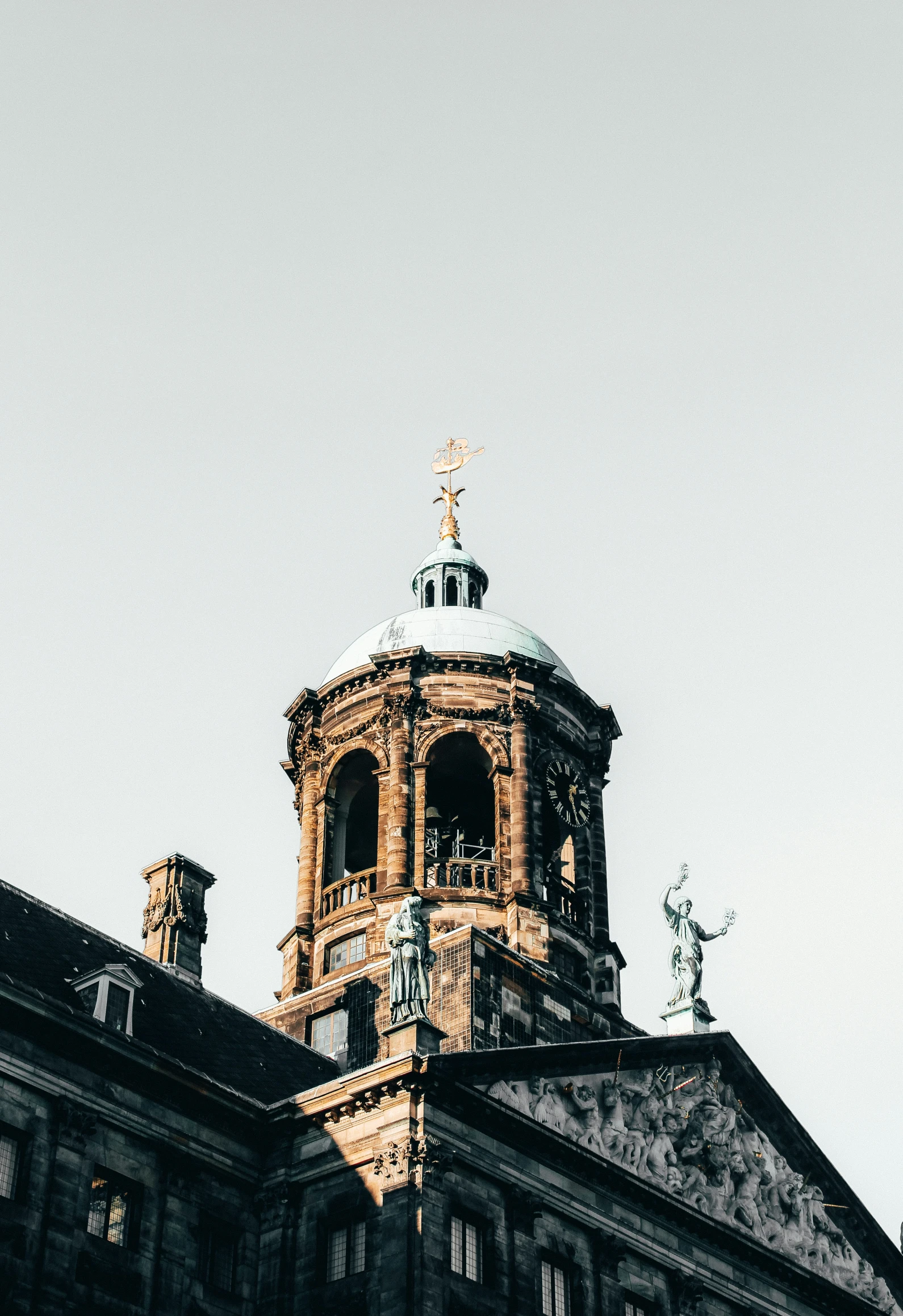 the side of a building, showing its bell tower and dome