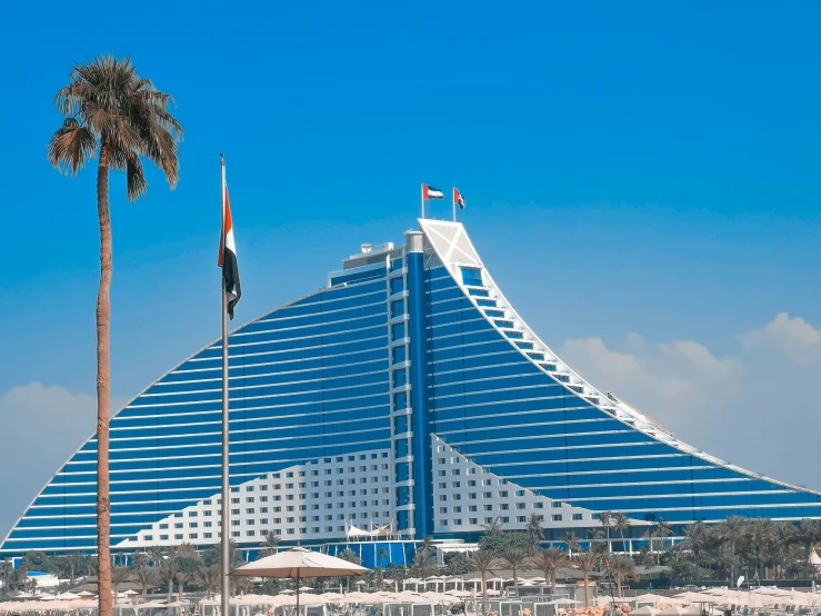 the el building is on the beach in front of the water