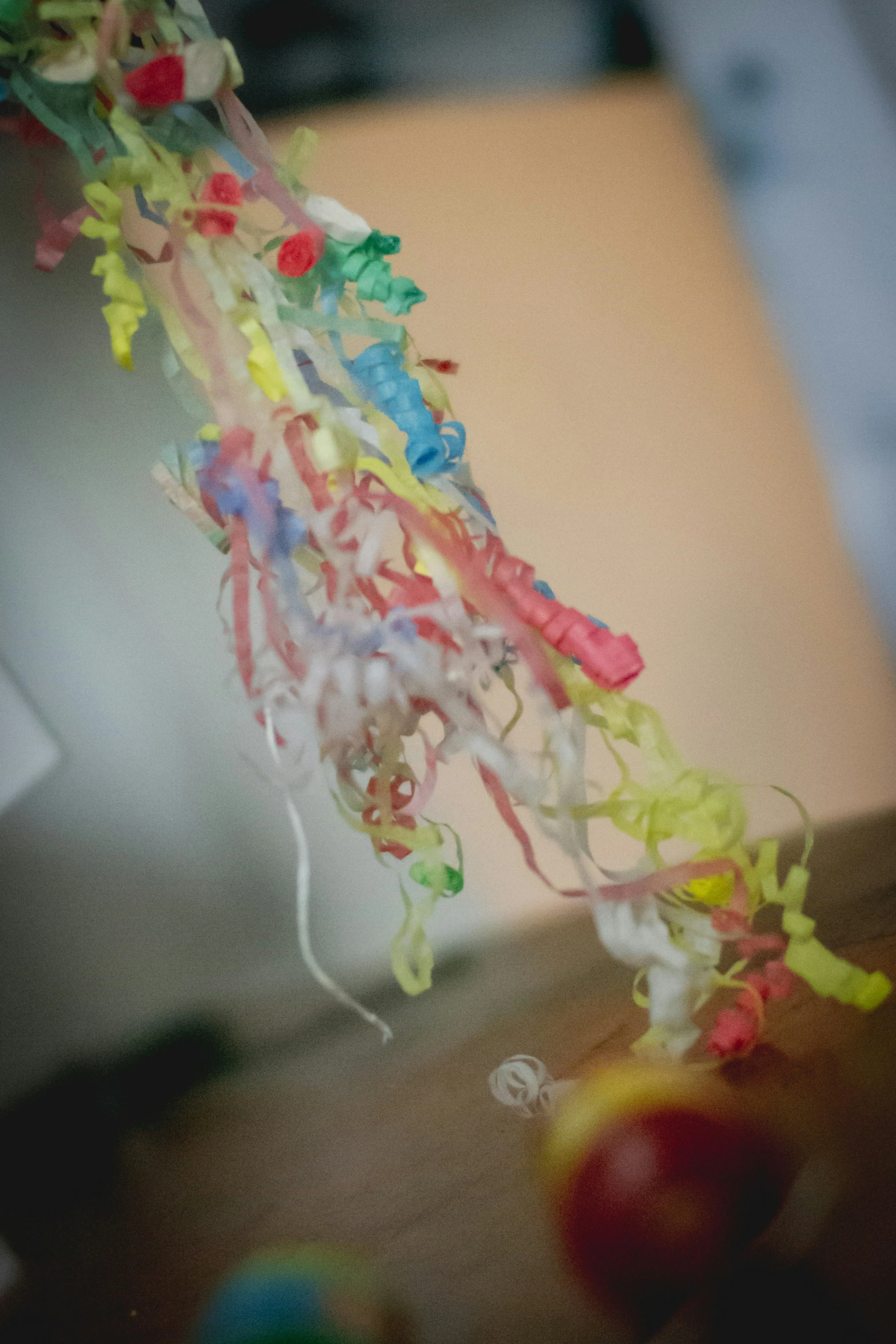 a close up of a string of different colored streamers