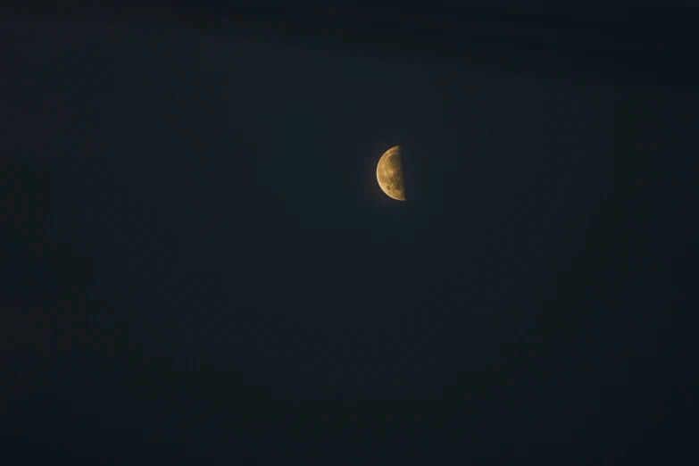 an image of a half moon taken with a telescope