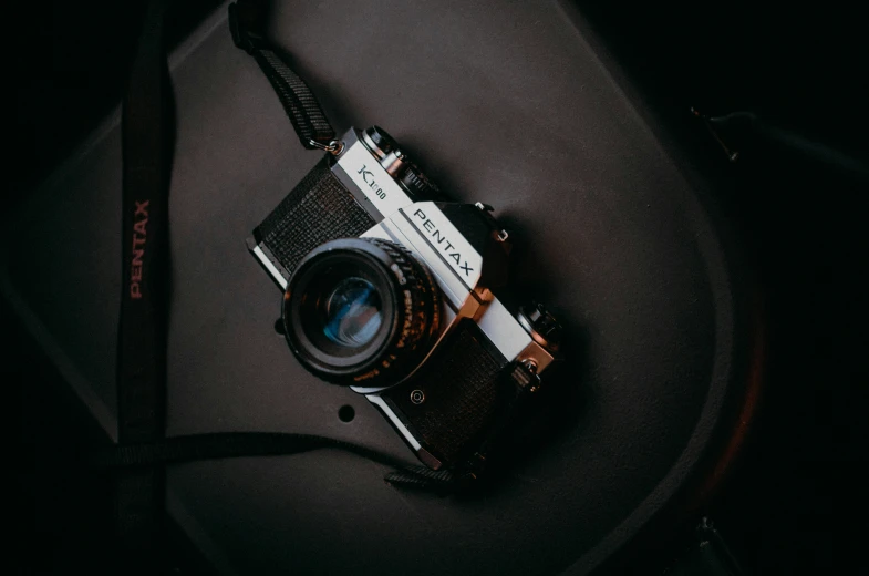 an old camera sitting on top of a table