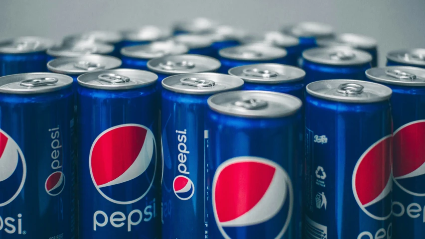 a close up of pepsi cans