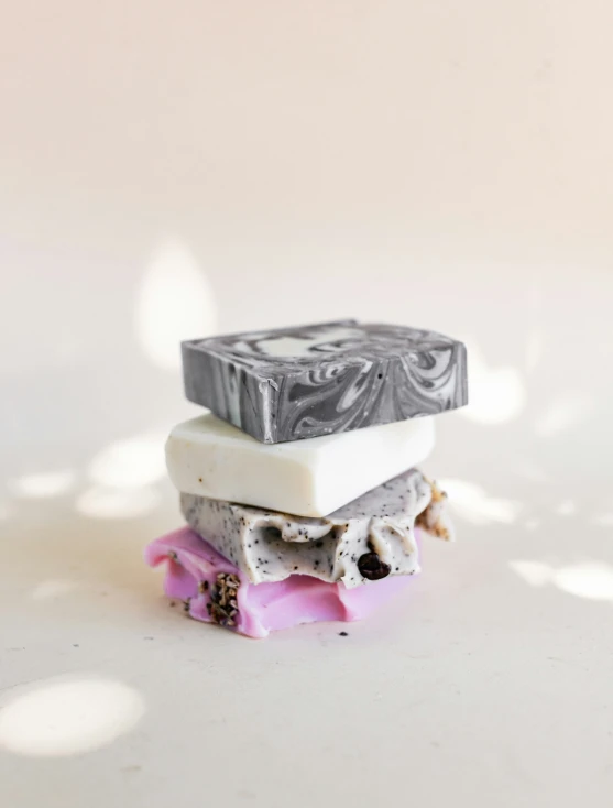 a white table with several bars of soaps on top