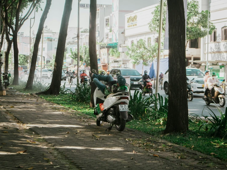 a motor scooter parked on a busy street