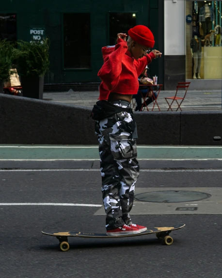 a man on a skateboard riding on the street