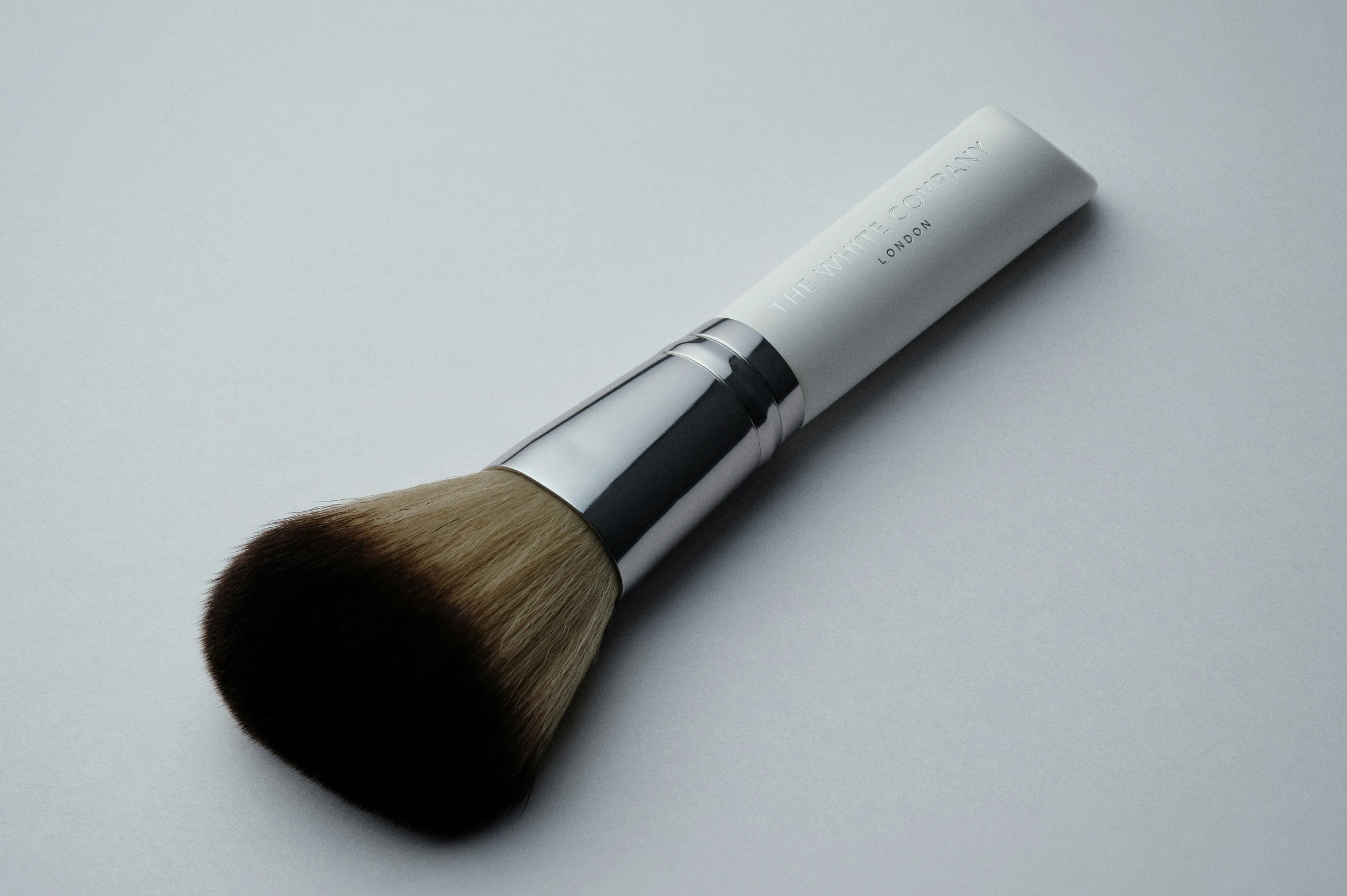 a makeup brush is seen in this closeup s