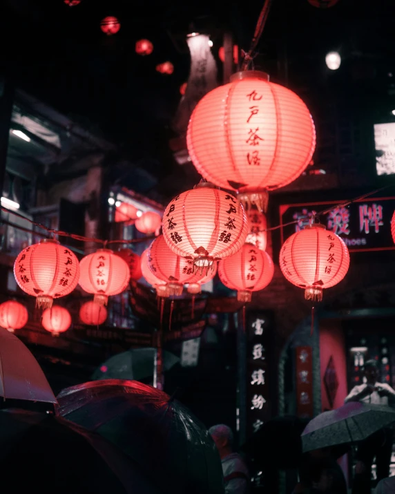 lots of lanterns hang in the air during the night