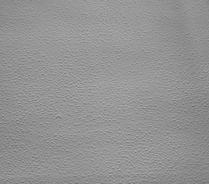 a close up image of a wall painted white