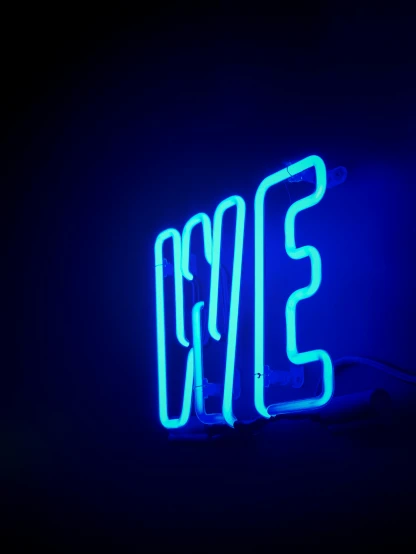 a neon sign that is next to a light bulb