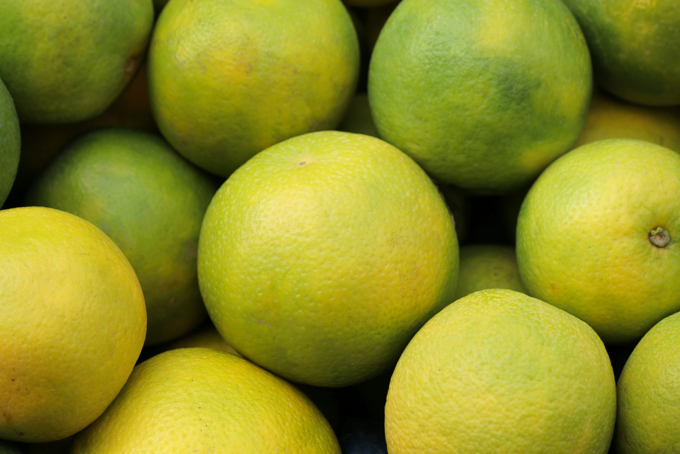 a pile of limes sitting next to each other