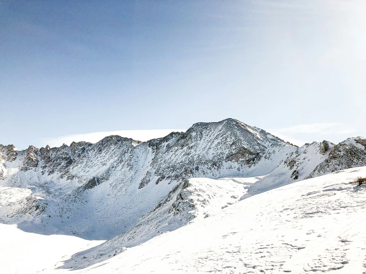 a skier who is snow skiing down the mountain