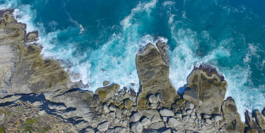 a beautiful aerial s of the coast near some rocks