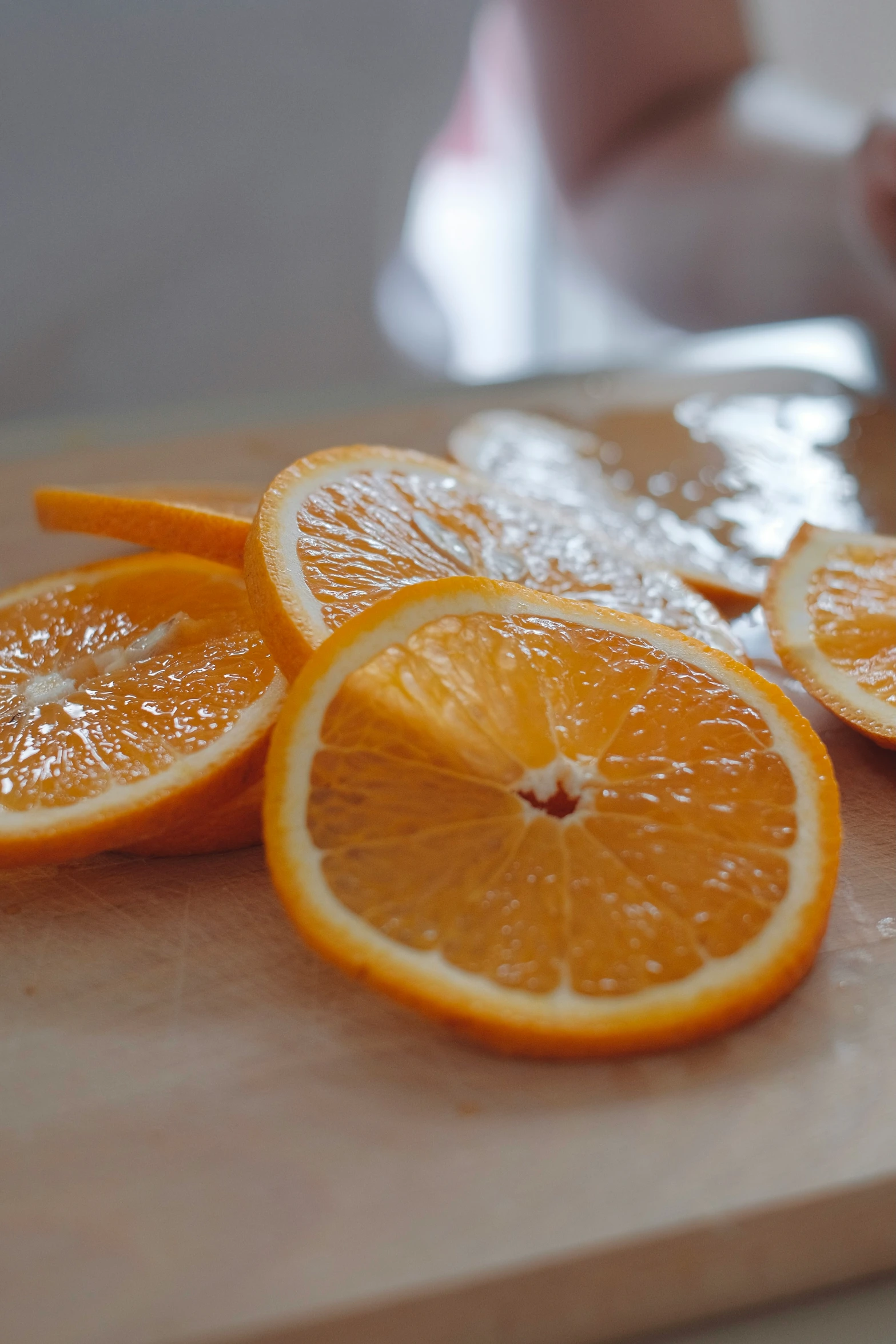 a wooden  board with orange slices on it