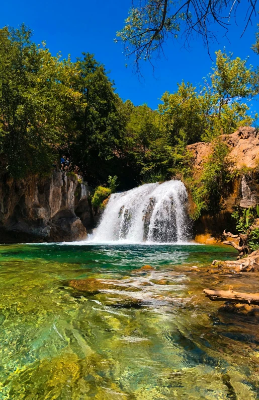 a waterfall is seen in this beautiful natural scene