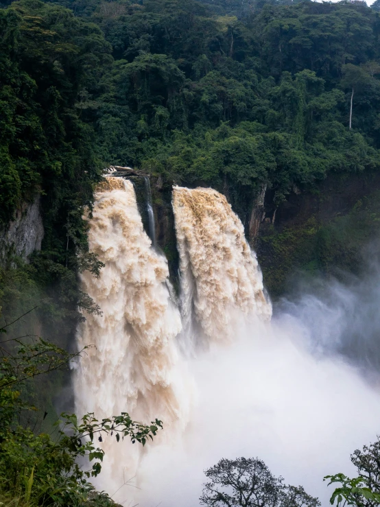 large waterfall with lots of water falling off it