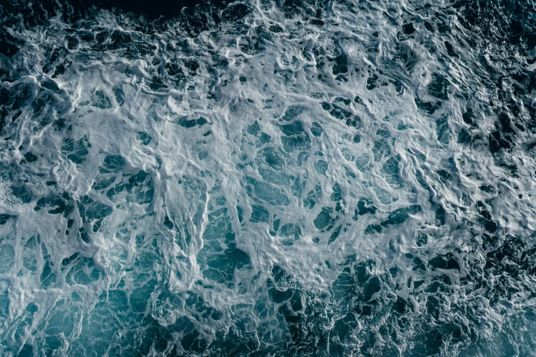 a very high overhead view of some waves