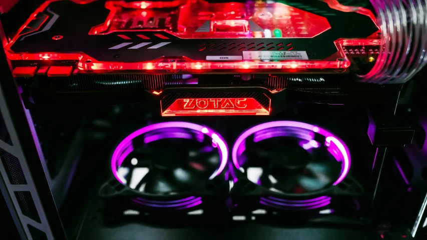 two red and purple lights sitting on top of a computer