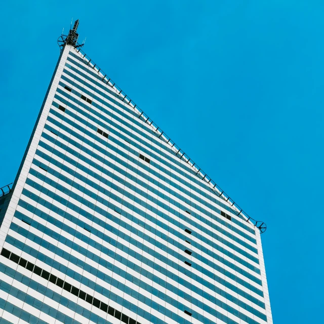 a tall building with a crane on top