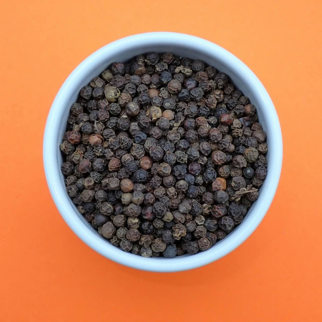 small blue bowl filled with different kinds of seeds