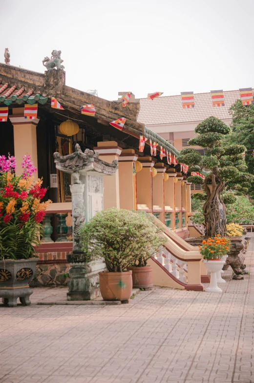 a park like area with small statues and flower displays