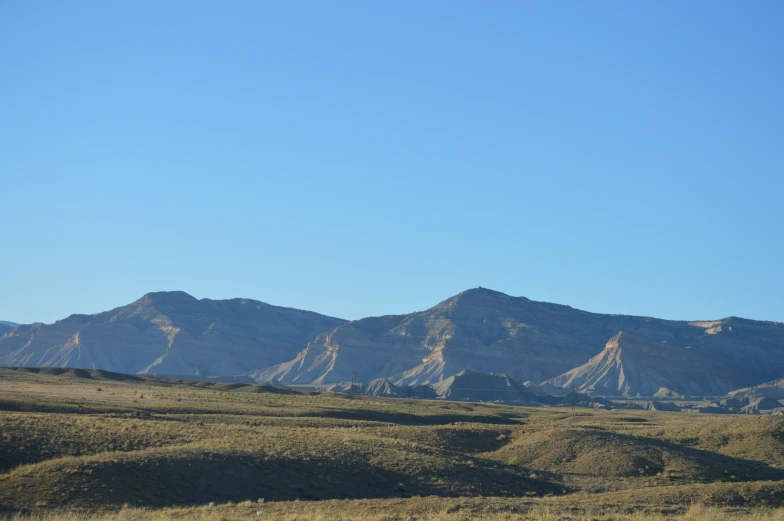 an outcropping of mountains in the foreground