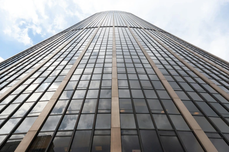 an upward view of the top of a tall building