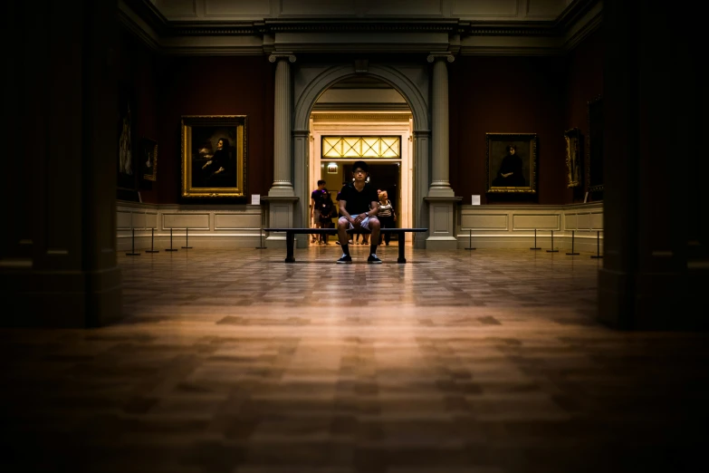 two people on a bench in a building