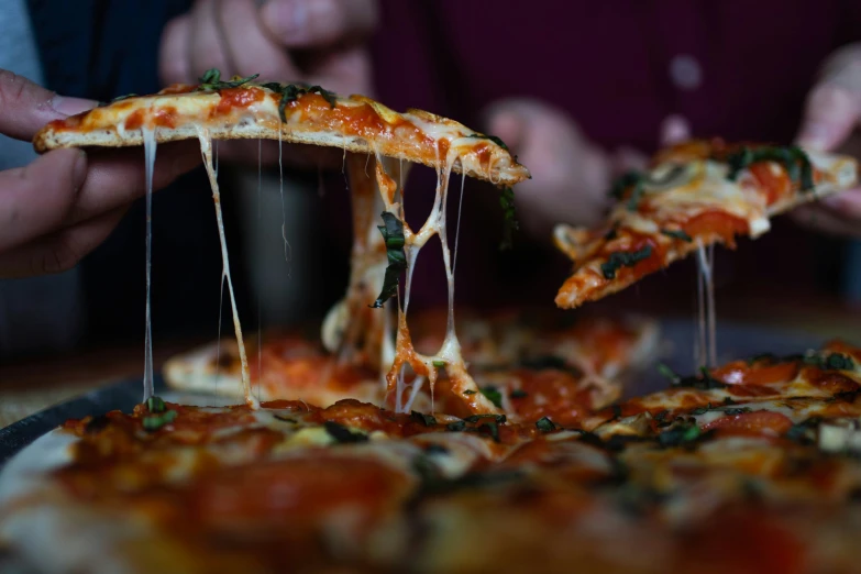 a pizza that has some sliced pieces taken out