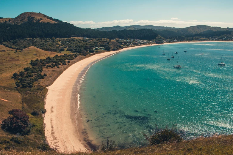 a beach that has boats in it