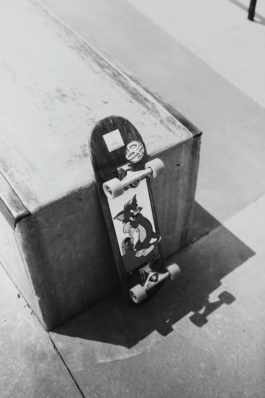 a skate board rests against a cement object