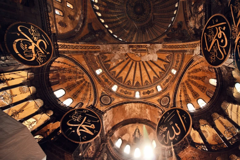 the ceiling of a mosque with arabic calligraphys