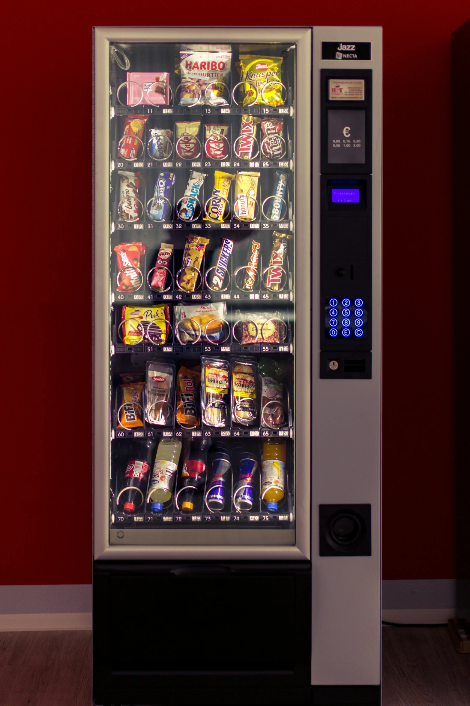 a vending machine with assorted snacks in it