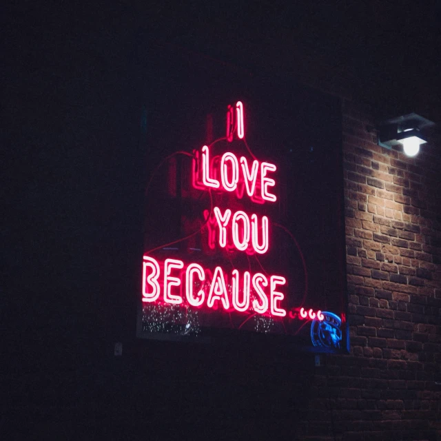a neon sign with the words i love you because