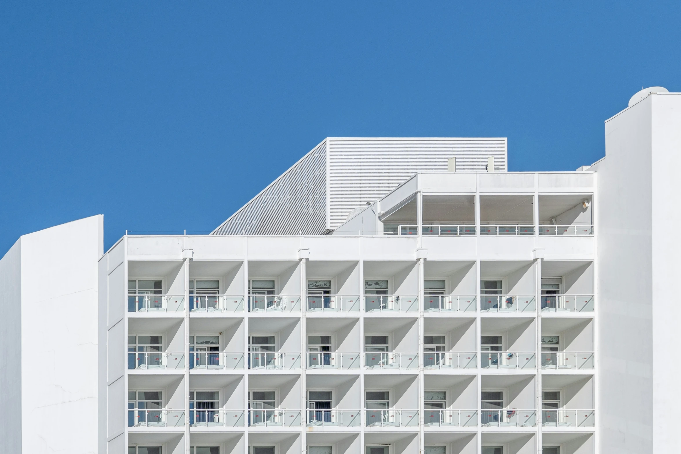 a building made up of windows and balconies