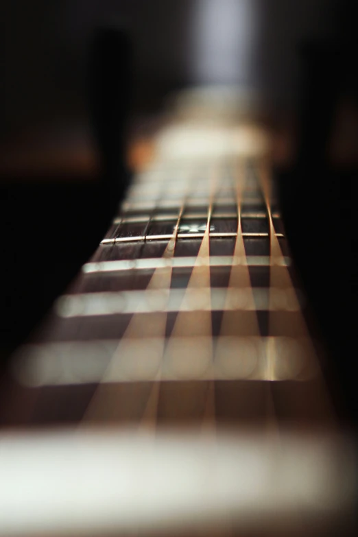 an abstract s of the side of a guitar strings