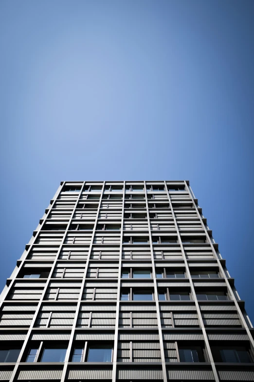 the front view of a tall building from below