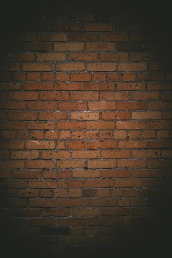 brick wall with a dark light shining on it
