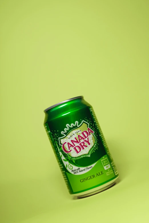 an cans of canned soda sitting in the middle of the picture