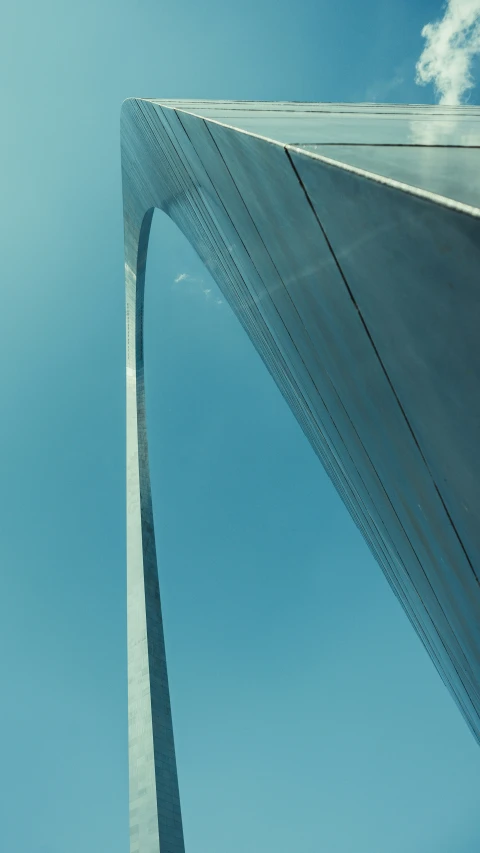 a view of the gateway arch and a tower structure from underneath