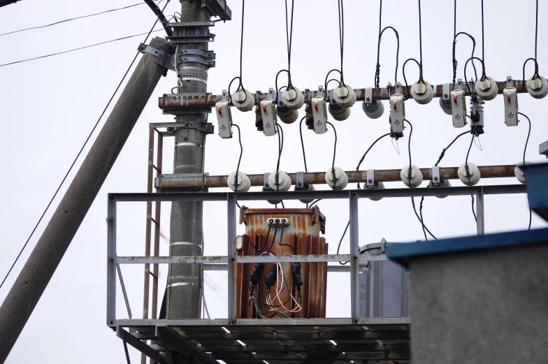 a clock with many wires hanging from it