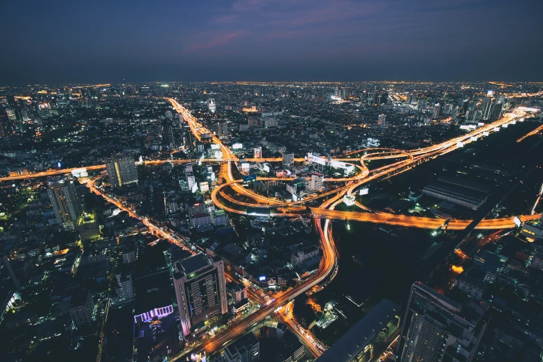 an overhead s of a busy city intersection at night