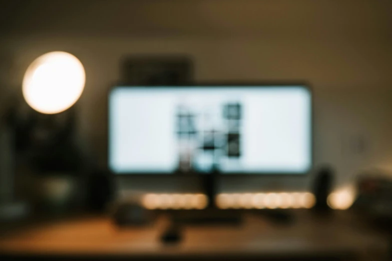 blurred pograph of a computer monitor in the foreground