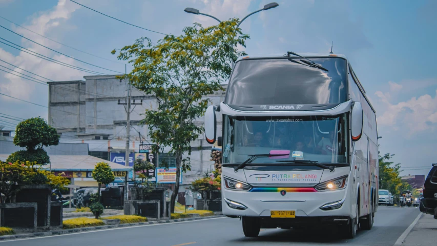 a bus is driving on the street with traffic