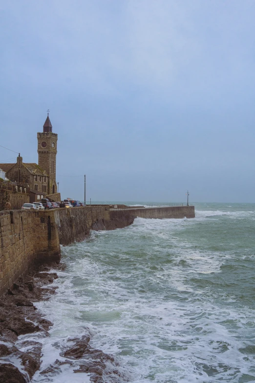 a large clock tower sticking out over the ocean