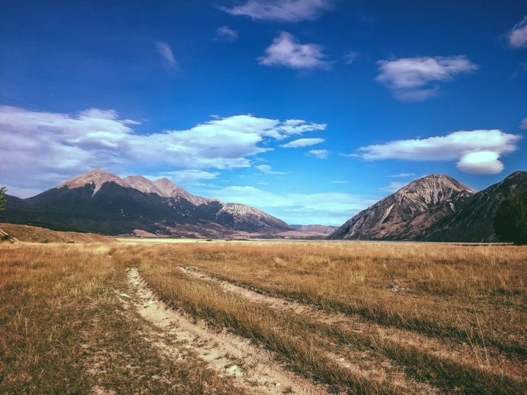 the view of the mountains from the field is very amazing