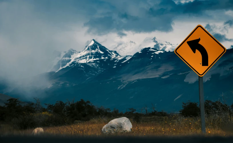 a highway sign and an image of a mountain