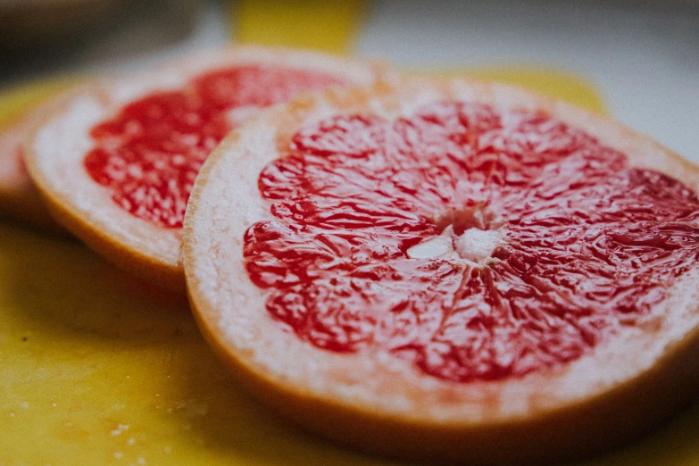 some fruit has been cut up and put on a  board