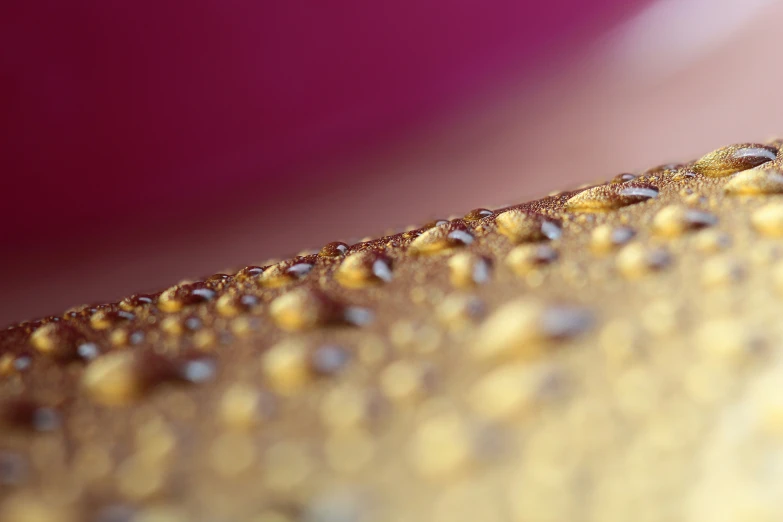 water drops on the surface of a brown table