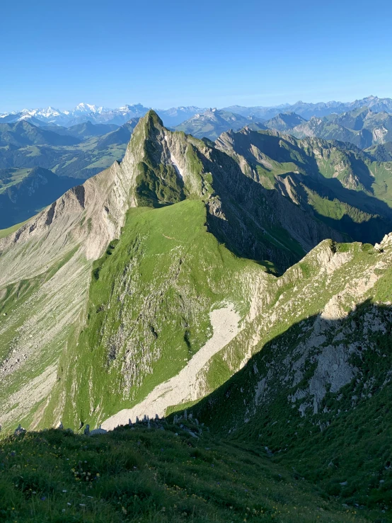 an aerial view of mountain ridges and valleys in a valley