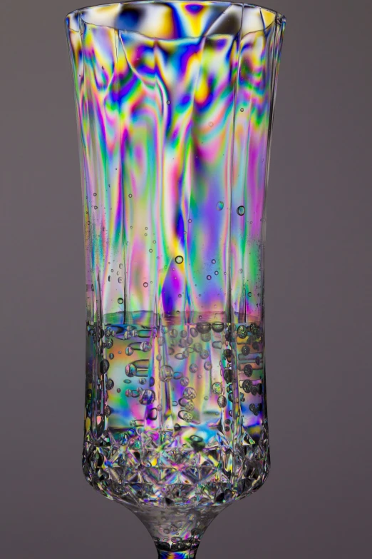 a colorful glass that looks like soing out of water